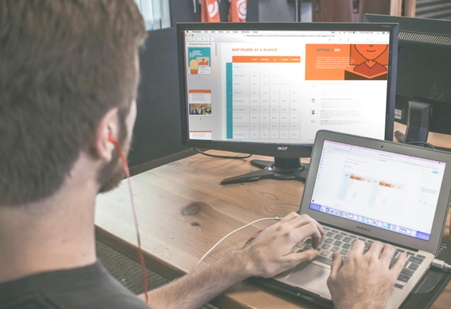 Person analyzing investment portfolio on computer screen